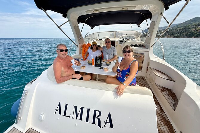 Cefalù: Private Mini Yacht Tour with Aperitif and Snorkeling - Spiaggia Caldura: a cove framed by rocks and greenery