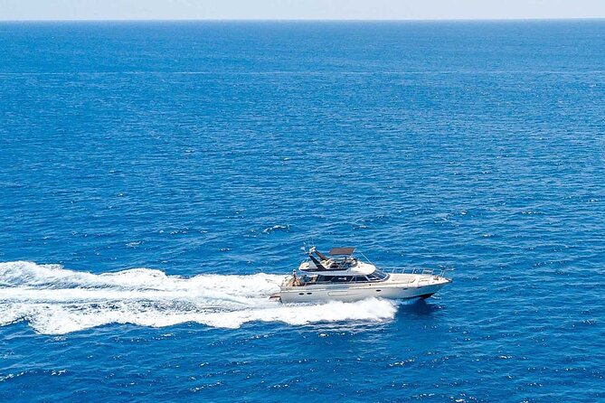 Half-Day Private Yacht Cruise in Rhodes - Traganou Beach stop: toast, drinks, and a relaxed hour