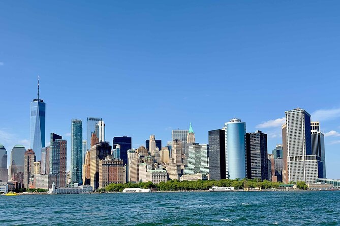 Manhattan Architecture Yacht Cruise - Statue of Liberty and the bridge-and-water photo wave