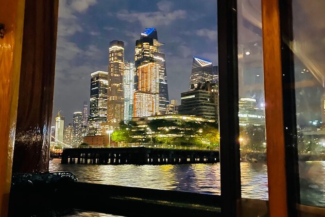 New York City Bright Lights Skyline Cruise on Yacht - Up-close Statue of Liberty at night: the photo moment that matters