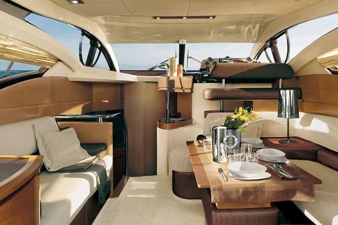 Private Motor Yacht Cruise with BBQ, Open Bar & Transfers - Caldera coast viewpoints: Venetian Lighthouse and the southern approach