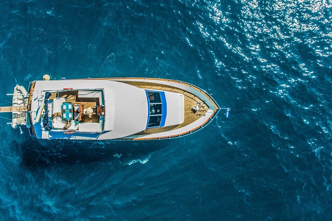 Santorini: Motor Yacht Day Cruise with 5-Course Lunch - The Caldera Cruise Route: Red and White Beaches to Palea Kameni and Nea Kameni